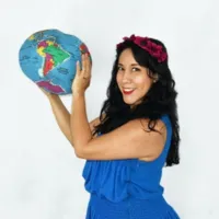 Flor Bromley holding a globe
