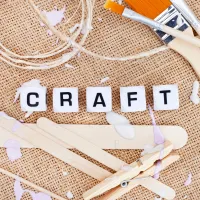 the word craft as bead letters with craft supplies
