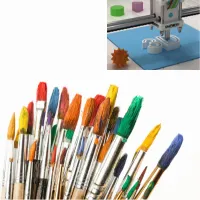 a 3d printer and paintbrushes